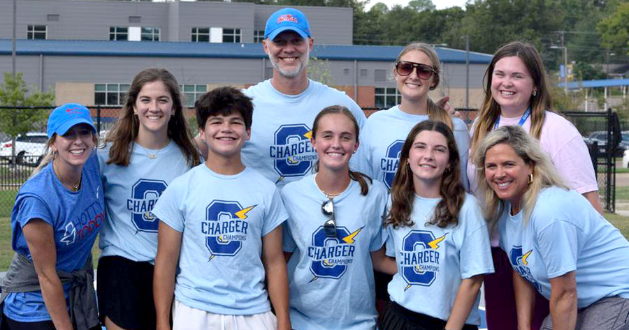 group photo of Charger Champions program leaders and volunteers