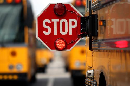 photo of a school bus’s stop sign 